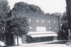 A black and white photo of a large brick building