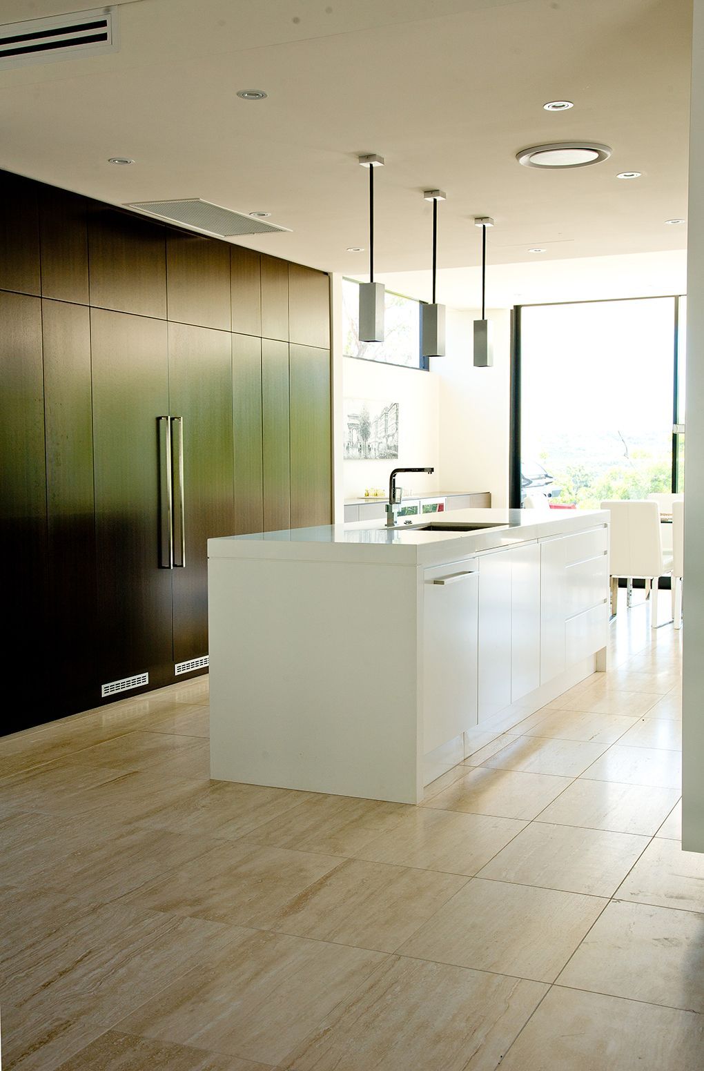Modern Kitchen With White Island, Dark Brown Cabinetry, and Pendant Lights — Burmah Constructions In Kangaroo Valley, NSW