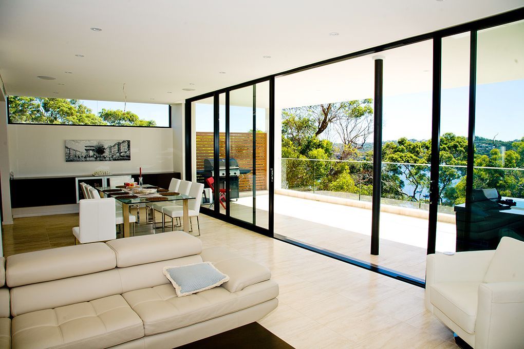 Modern Living Room With Large Glass Sliding Doors — Burmah Constructions In Kangaroo Valley, NSW