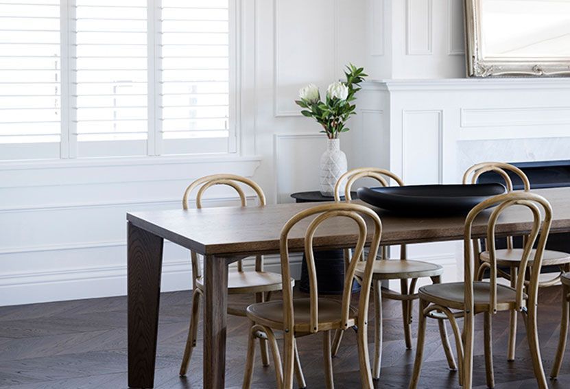 Dining Room With Wooden Table, Gold Chairs, and Flowers — Burmah Constructions In Kangaroo Valley, NSW