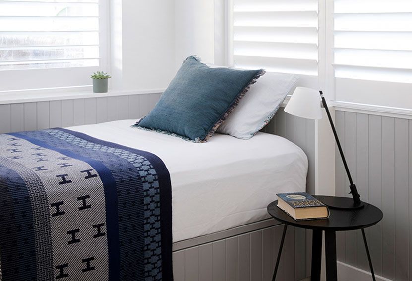 Cozy Bedroom With a Twin Bed. White Bedding — Burmah Constructions In Kangaroo Valley, NSW