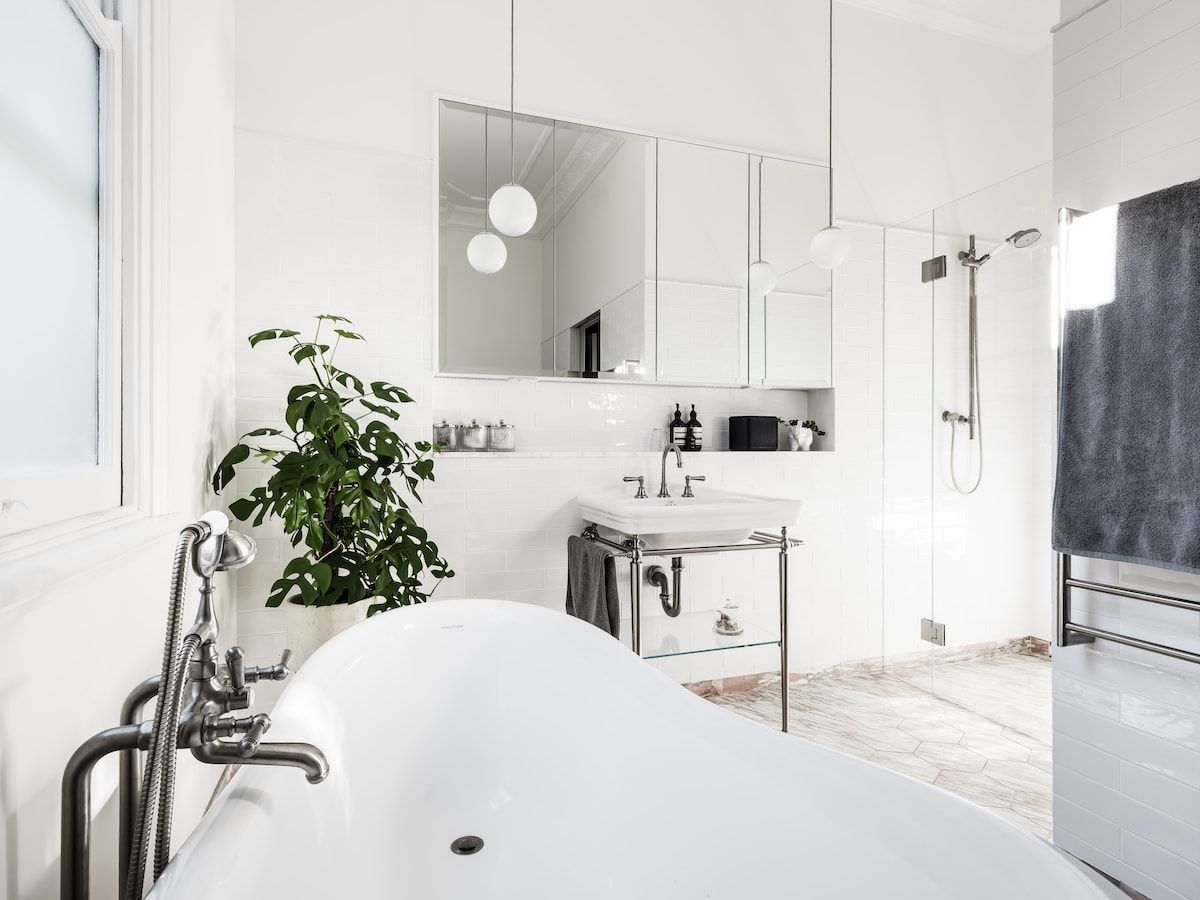 White Bathroom With a Freestanding Tub, Sink, and Shower — Burmah Constructions In Kangaroo Valley, NSW