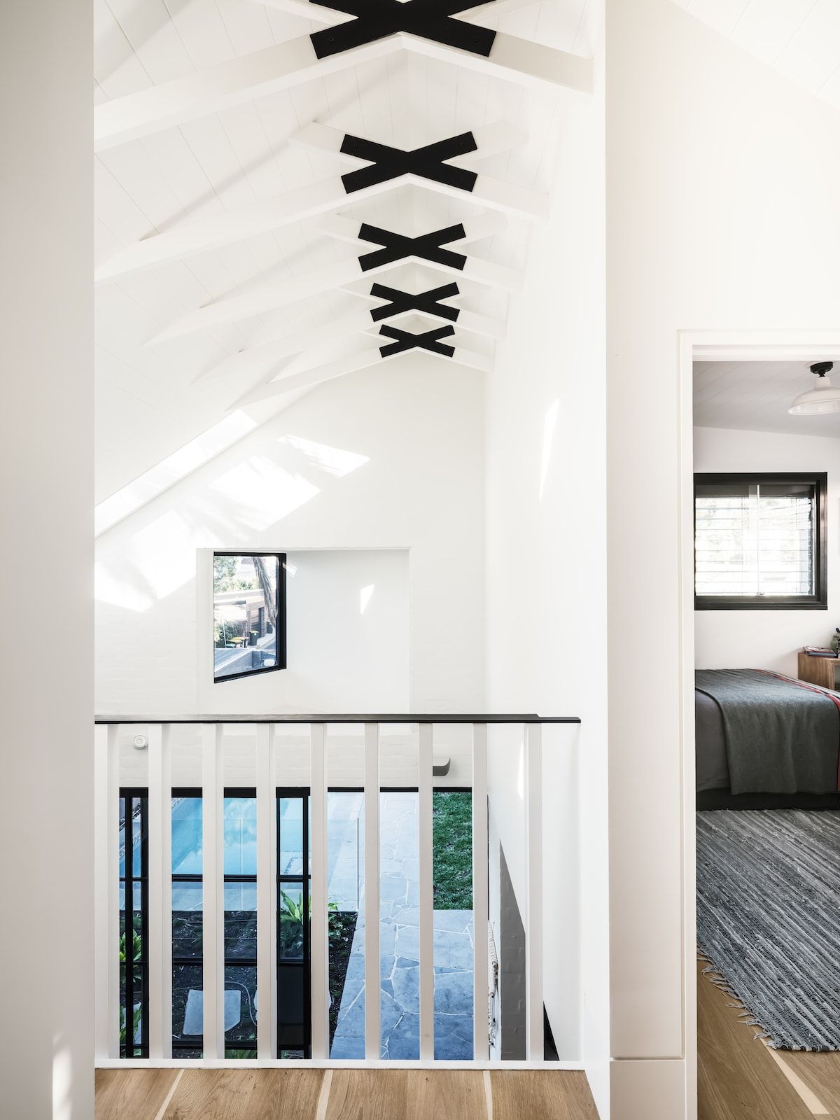 Interior View of a White Hallway With a Balcony and Bedroom Visible — Burmah Constructions In Kangaroo Valley, NSW