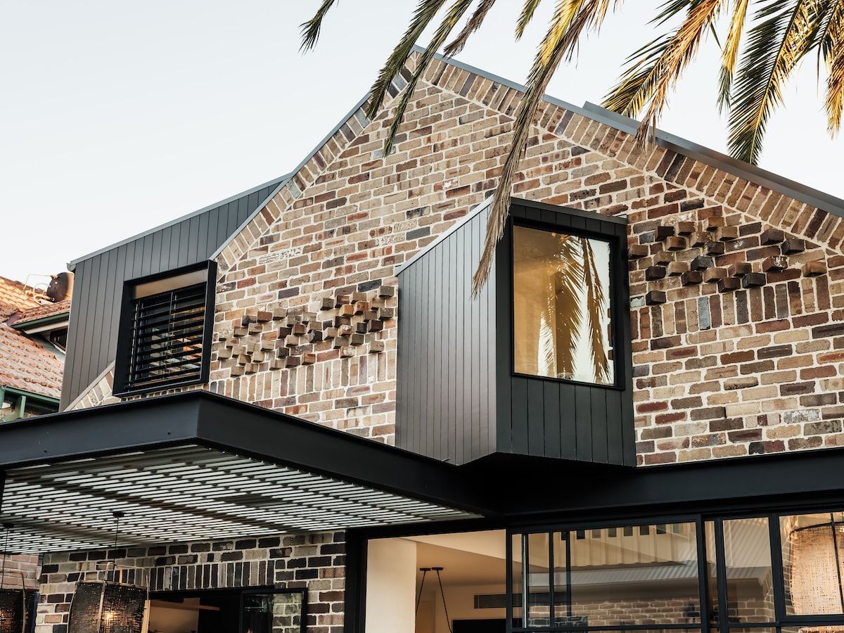 Brick Building With a Modern Metal Window Addition and a Black Awning — Burmah Constructions In Kangaroo Valley, NSW