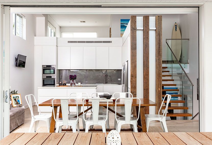 Modern Kitchen and Dining Area With White Cabinets — Burmah Constructions In Kangaroo Valley, NSW