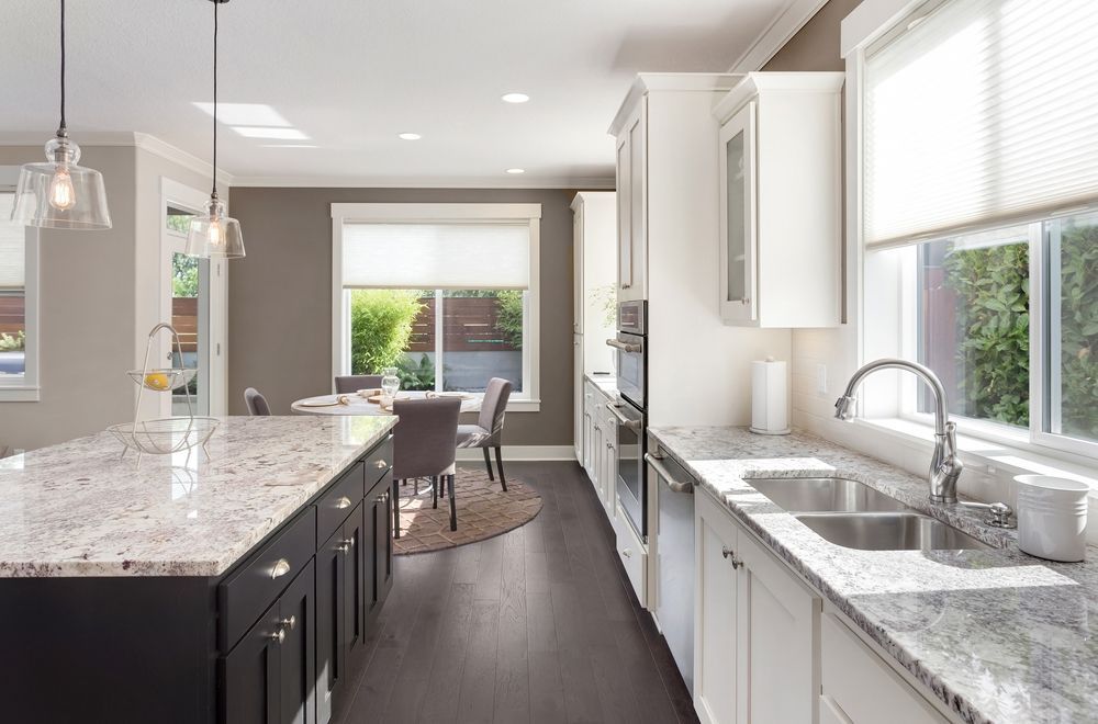 Modern Kitchen With White Cabinets — Burmah Constructions in Nowra, NSW