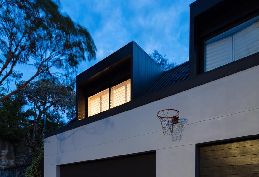 Modern House Exterior at Dusk With Basketball Hoop — Burmah Constructions In Kangaroo Valley, NSW
