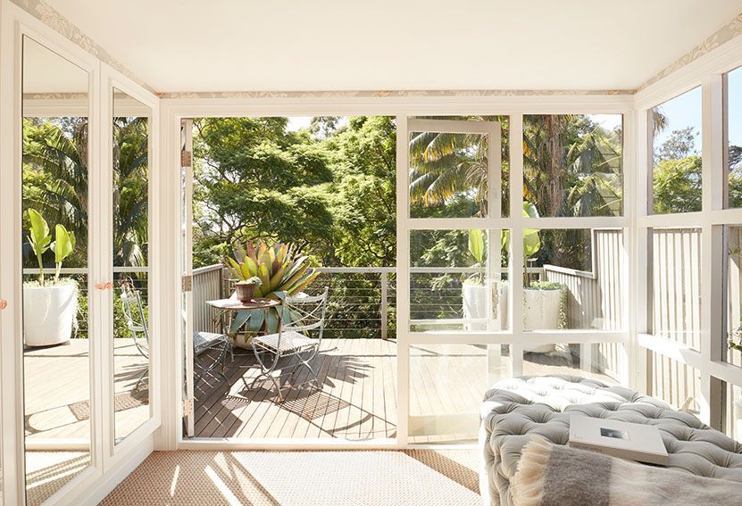 Sunroom With Open Glass Doors Leading to a Balcony With Table — Burmah Constructions In Kangaroo Valley, NSW