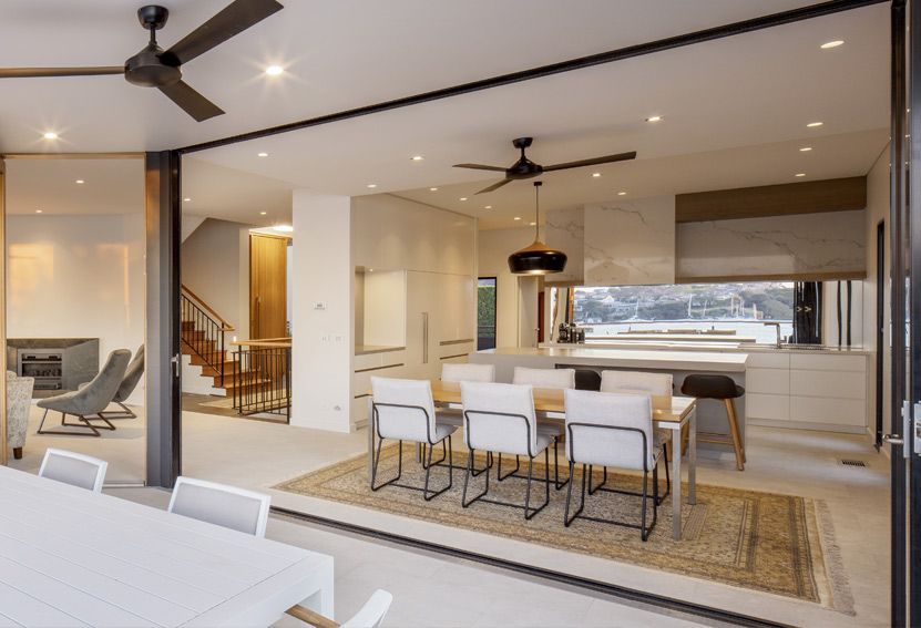 Open-plan Kitchen and Dining Area With Sliding Doors — Burmah Constructions In Kangaroo Valley, NSW