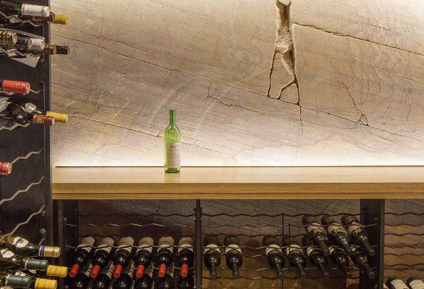 Wine Bottles in a Cellar, a Green Bottle on a Shelf — Burmah Constructions In Kangaroo Valley, NSW