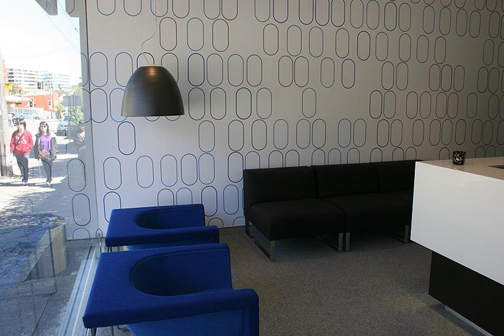 Interior With Patterned Wall, Blue Chairs, Black Sofa, and Hanging Lamp — Burmah Constructions In Kangaroo Valley, NSW