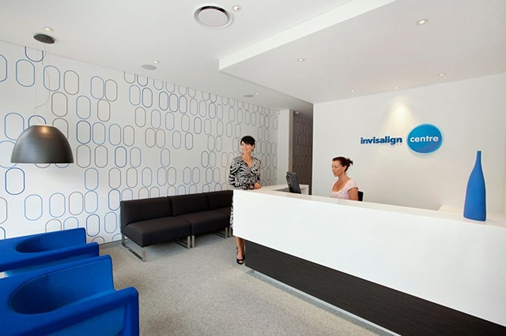 Modern Office Reception Area With Two Women Behind a White Desk — Burmah Constructions In Kangaroo Valley, NSW