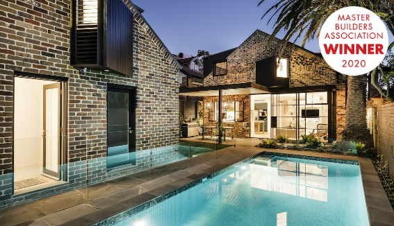 Brick House With Pool at Dusk — Burmah Constructions In Kangaroo Valley, NSW