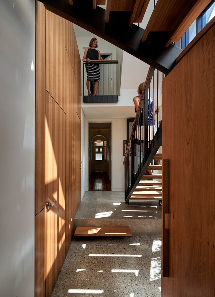 Hallway With Wooden Cabinetry, Stairs, and Two People on a Balcony — Burmah Constructions In Kangaroo Valley, NSW