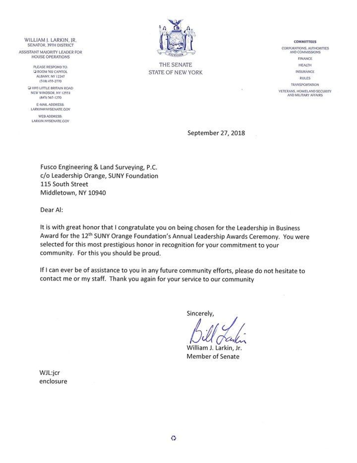 A letter with a signature on it is on a white background.