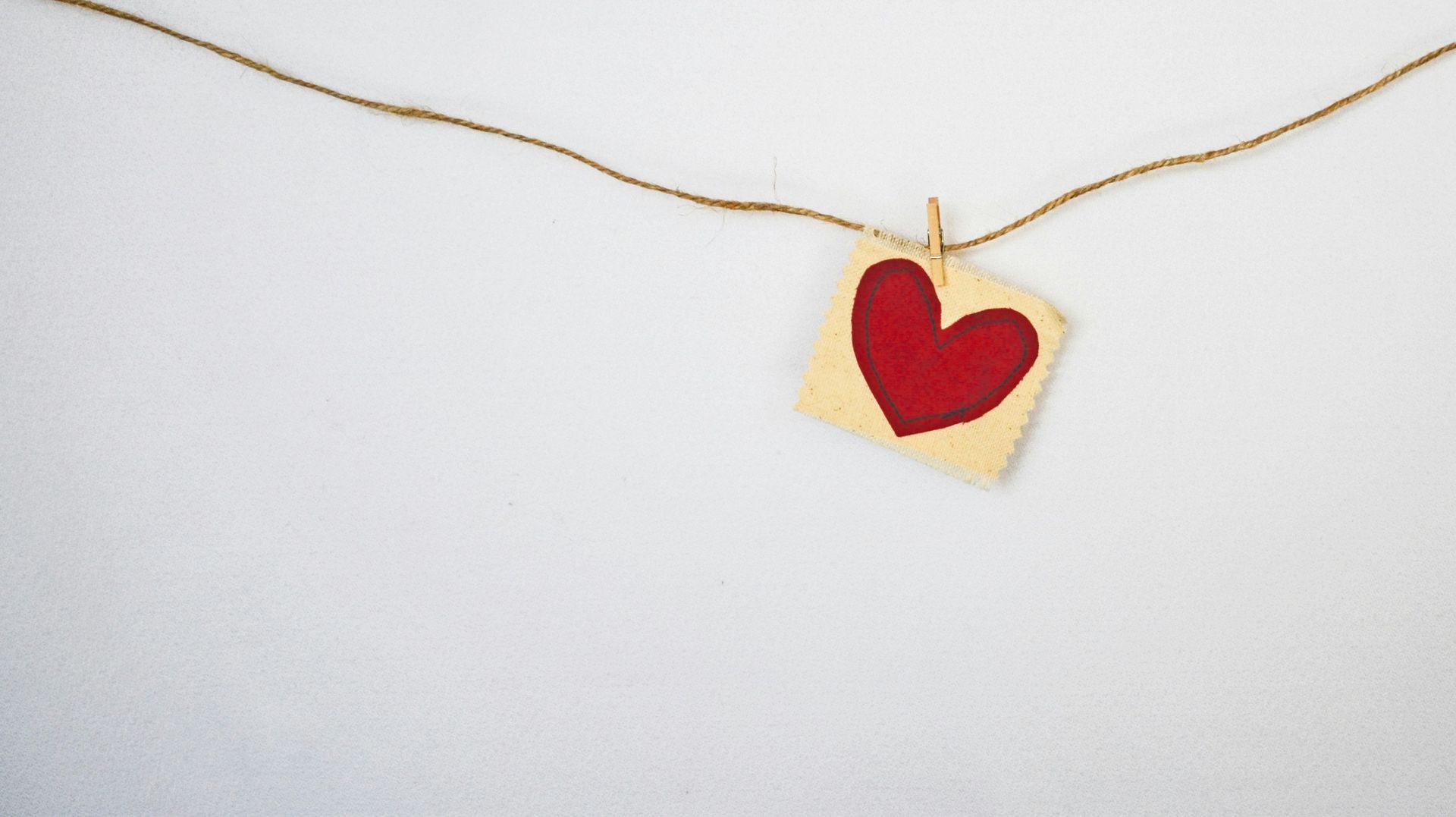 Picture of a red heart on a string