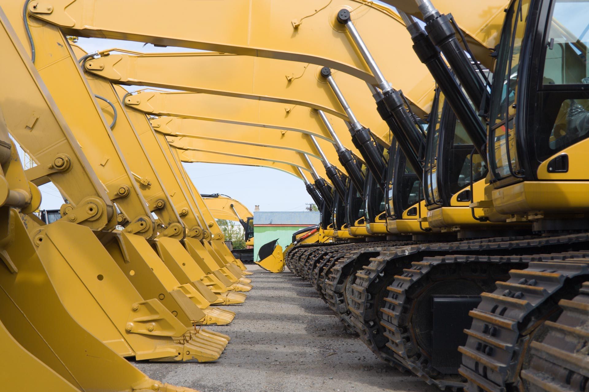 Row of Yellow Construction Vehicles — Madisonville, KY — Wil-Mar Hydraulics & Machine Inc.