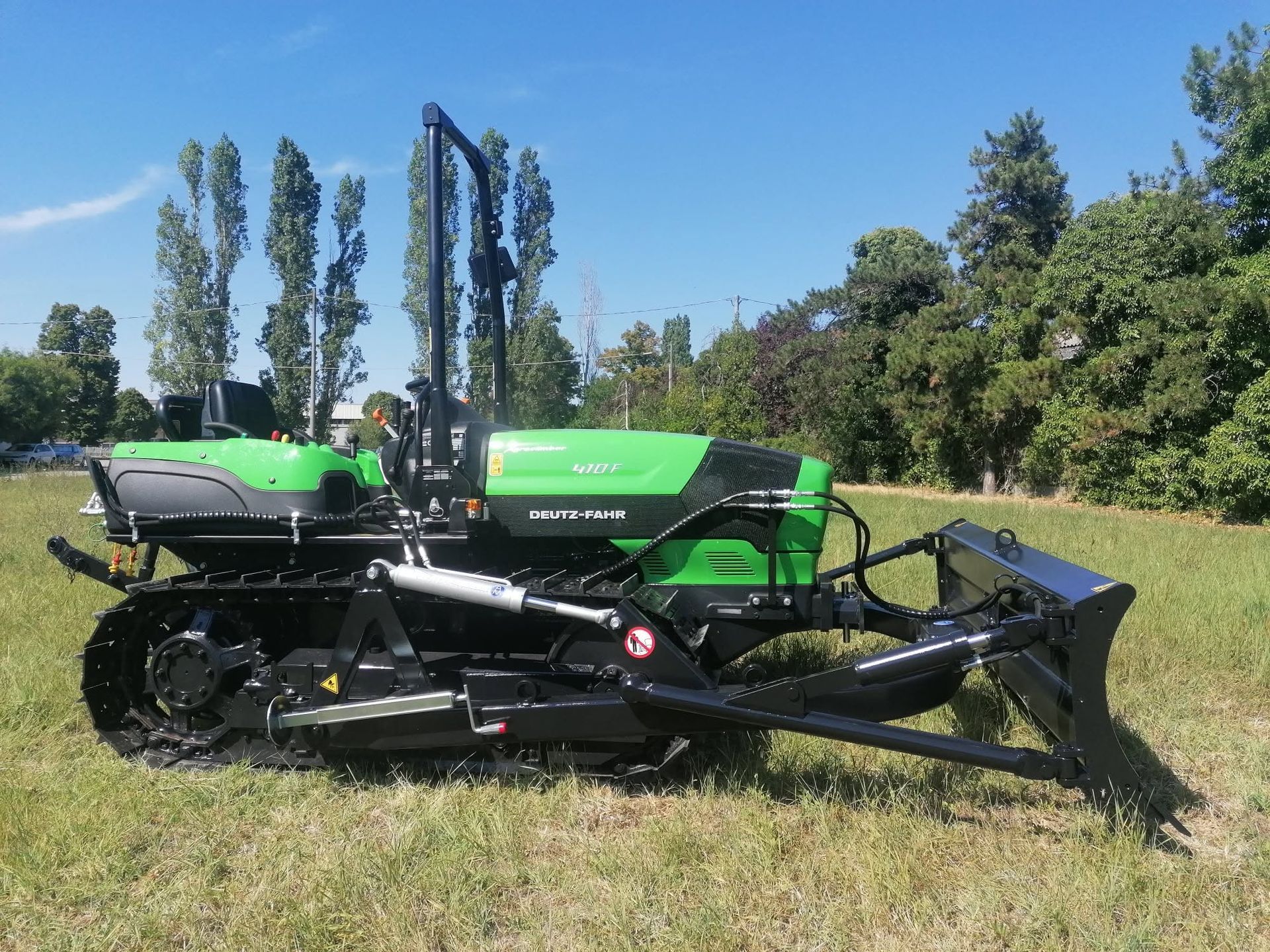 Efficient Tractor at Work in the Field — Thompson's Farm Gear In Coffs Harbour, NSW
