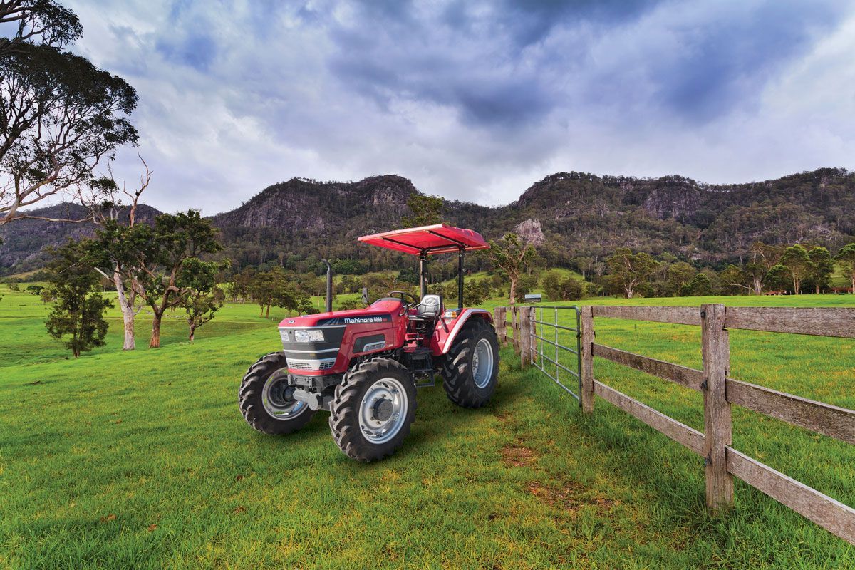 Tractor with SAM Machinery in a Green Field — Thompson's Farm Gear In Wauchope, NSW