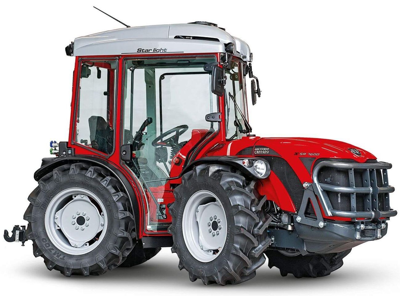 On a White Surface Sits a Red Tractor — Thompson's Farm Gear In Wauchope, NSW