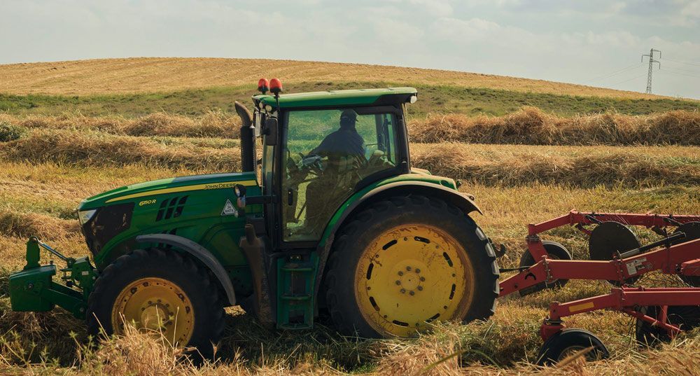 Driving a Tractor Through the Hay Bale Fields — Thompson's Farm Gear In Coffs Harbour, NSW