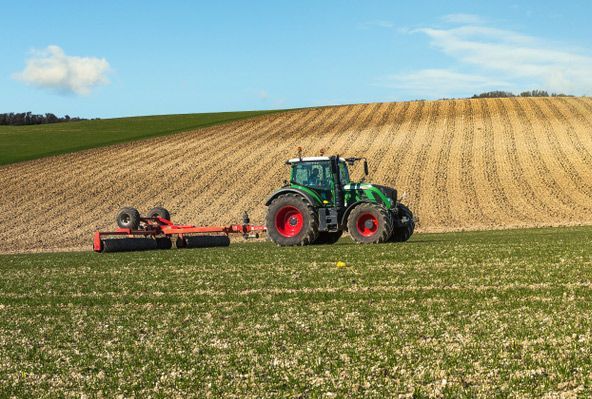 Farmer Ploughing Expansive Fields — Thompson's Farm Gear In Coffs Harbour, NSW