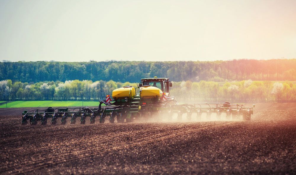 Farm Tractor Cultivating and Sowing Seeds — Thompson's Farm Gear In Taree, NSW