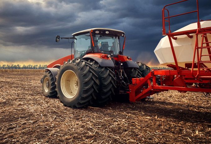 Contemporary Agricultural Tractor in Action on the Farm — Thompson's Farm Gear In Kempsey, NSW