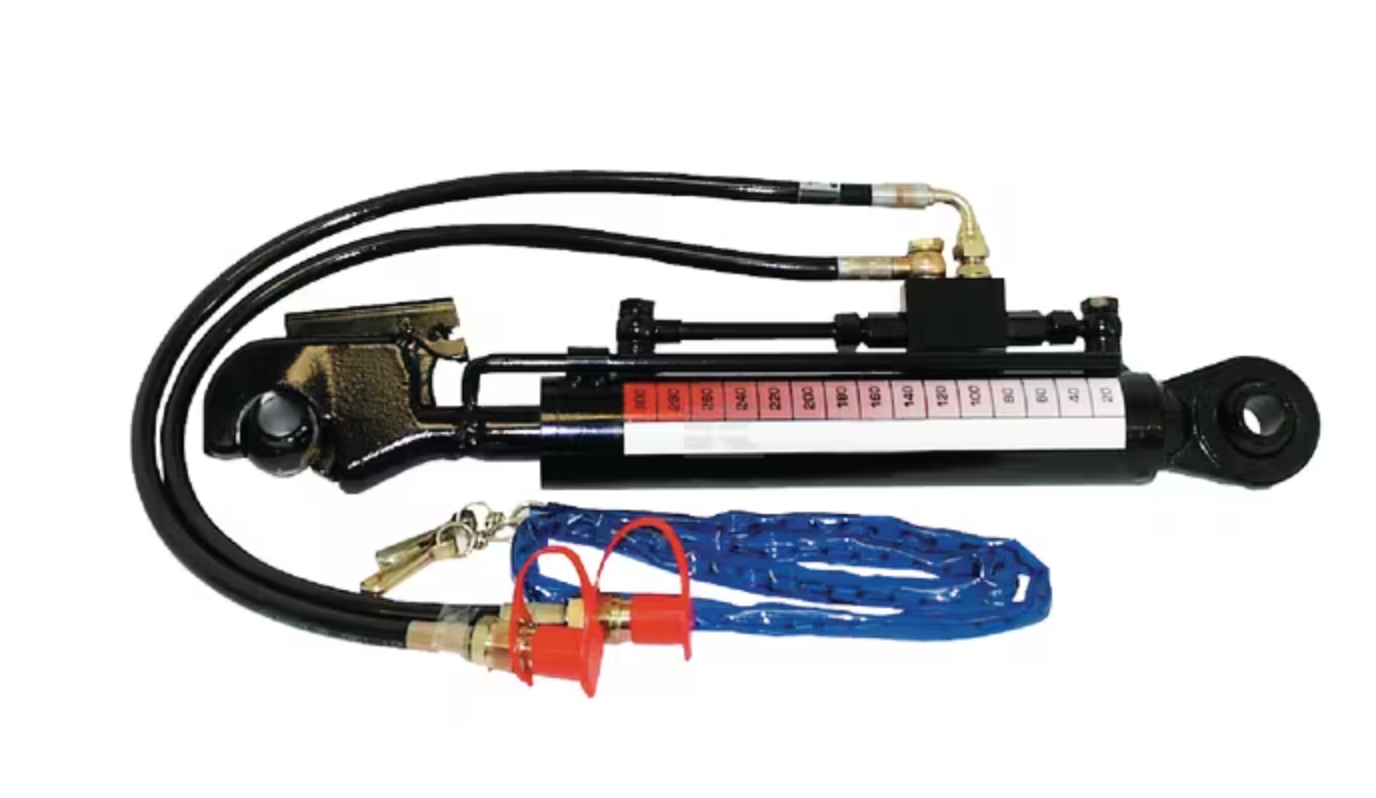 Two Tractors Are Parked in A Grassy Field — Thompson's Farm Gear In Coffs Harbour, NSW