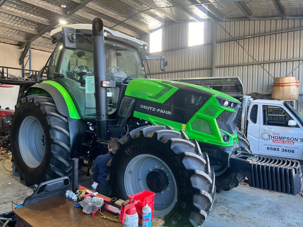 Thompson Farm Gear Servicing a Green Tractor, Model 6145-6 — Thompson's Farm Gear In Taree, NSW
