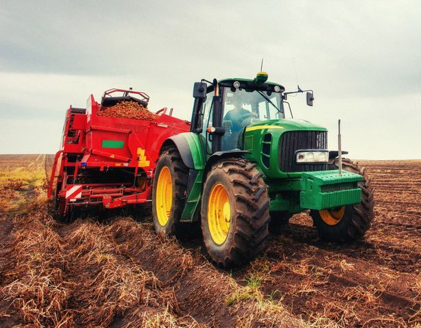 Farm Tractor Ploughing the Land — Thompson's Farm Gear In Wauchope, NSW