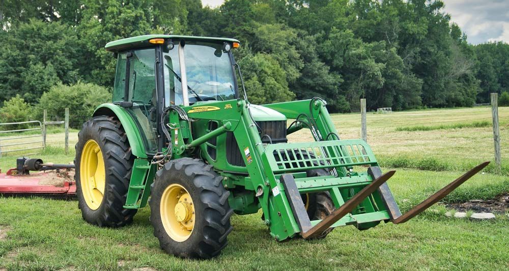 Tractor with Bush Hog Attachment Ready for Farm Work — Thompson's Farm Gear In Taree, NSW