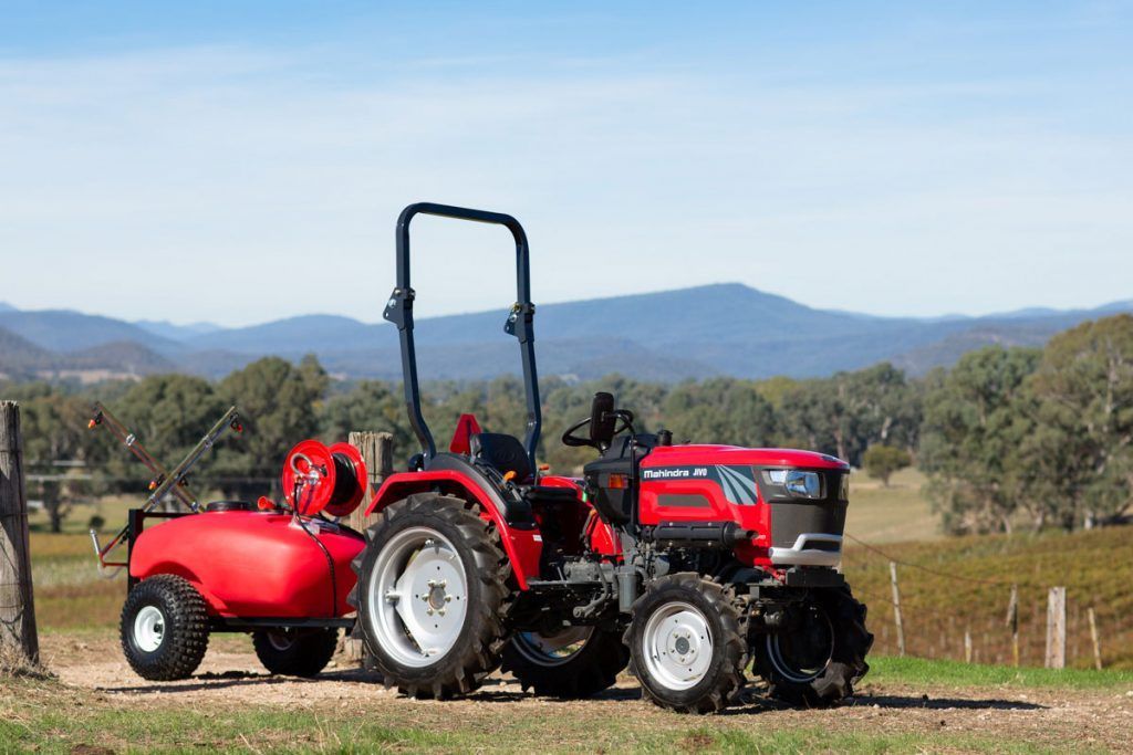 Tractor Speeding Across the Field — Thompson's Farm Gear In Kempsey, NSW