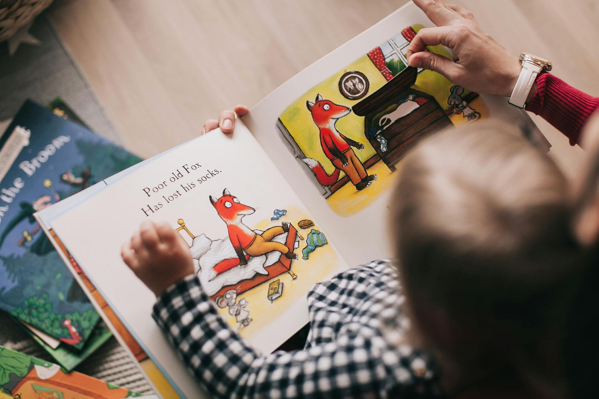 Child and parent reading bedtime story