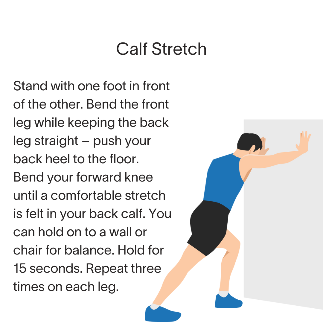 A man is stretching his calf while standing with one foot in front of the other.