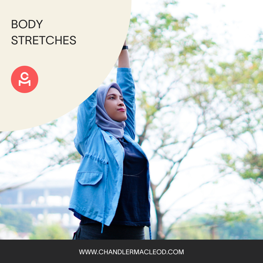 A woman wearing a hijab and a blue jacket is doing body stretches
