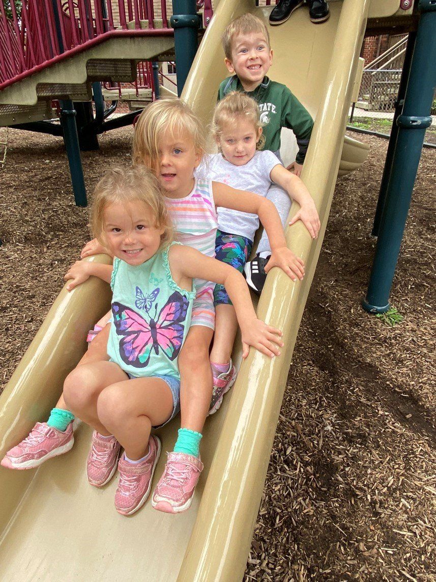 Infant Playing With Beads — Canton, MI — Beginners Inn Childcare & Learning Center