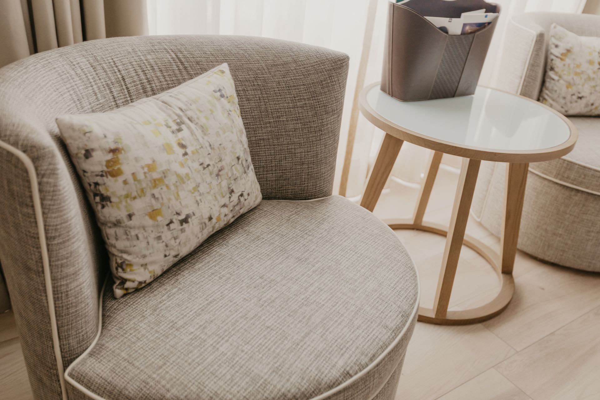 Elegant chair with patterned cushion adding charm to a stylish residential living space décor.