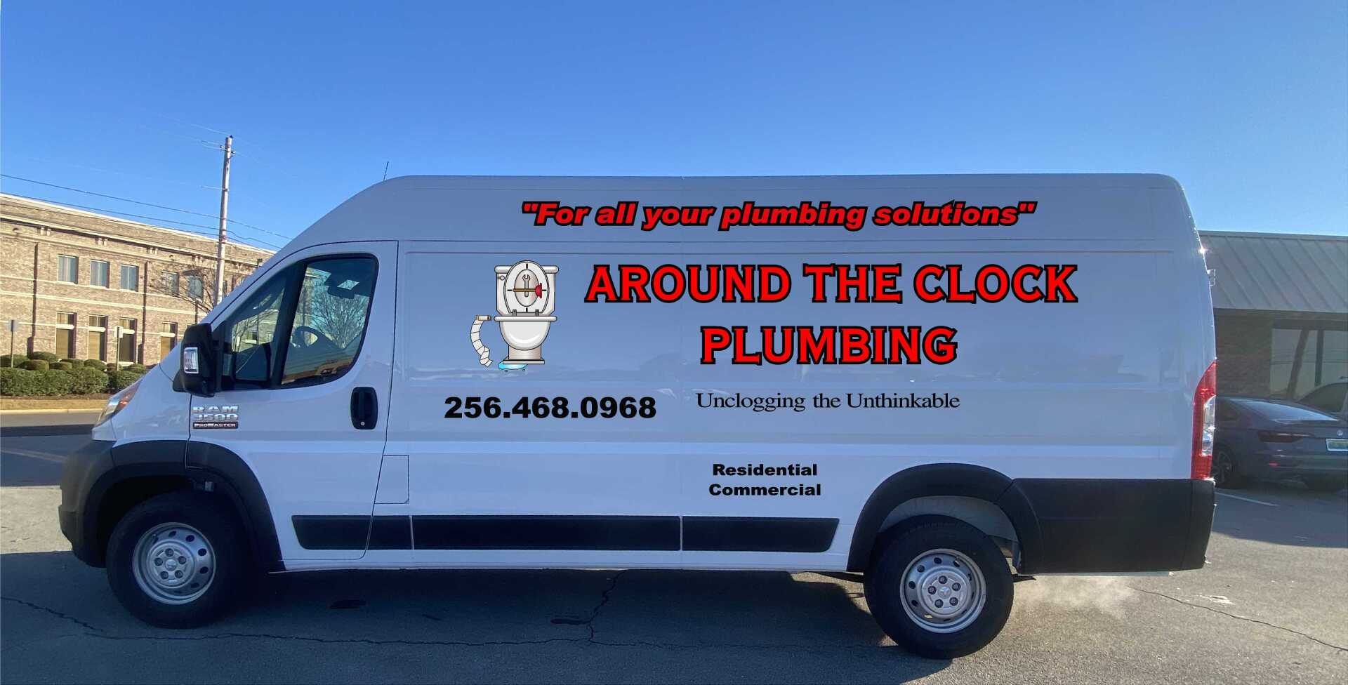 A white van for around the clock plumbing is parked in a parking lot.