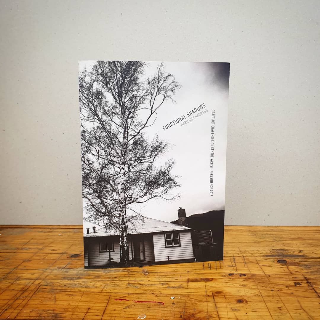 A Black and White Photo of a Tree and a House on a Wooden Table — Brindabella Print In Pearce, ACT