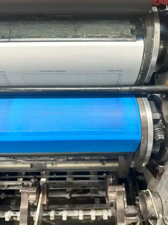 A Close Up of a Blue Roller on a Printing Machine — Brindabella Print In Pearce, ACT