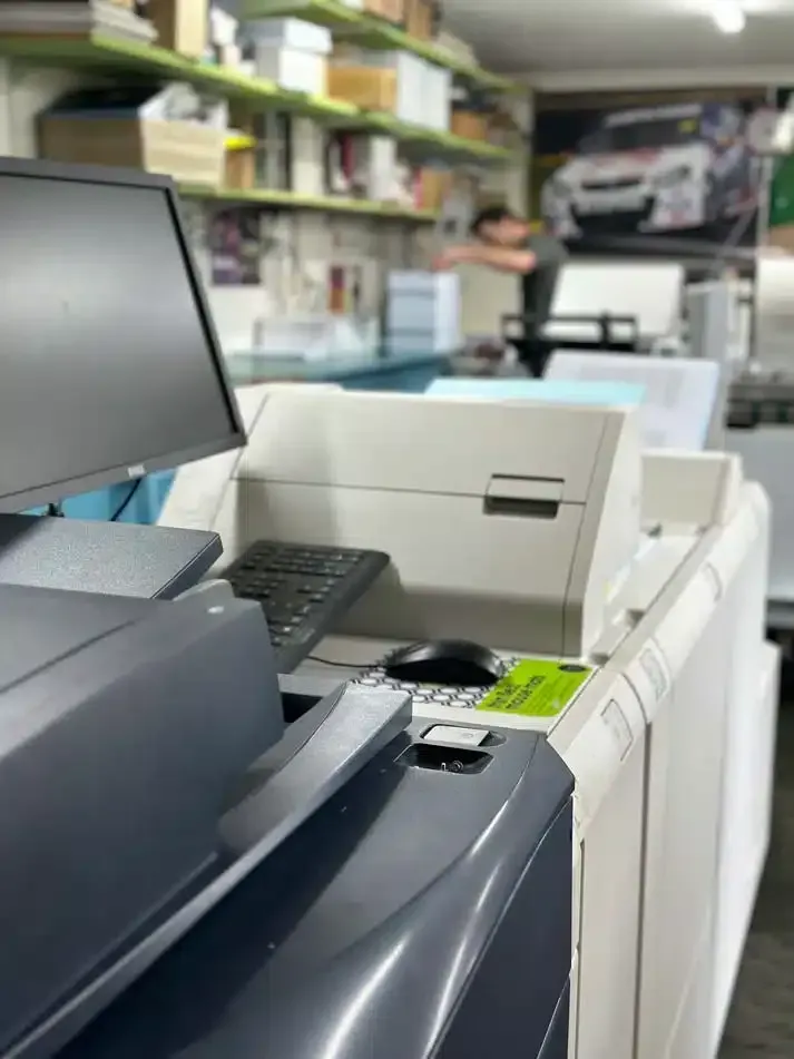 A Computer is Sitting on Top of a Printer in a Room — Brindabella Print In Pearce, ACT