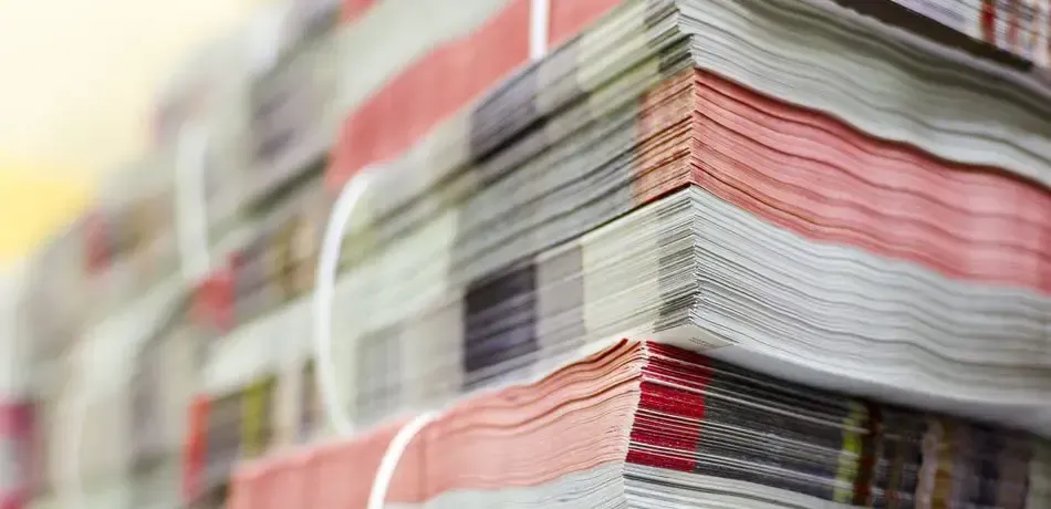 A Close Up of a Stack of Newspapers on a Shelf — Brindabella Print In Belconnen, ACT