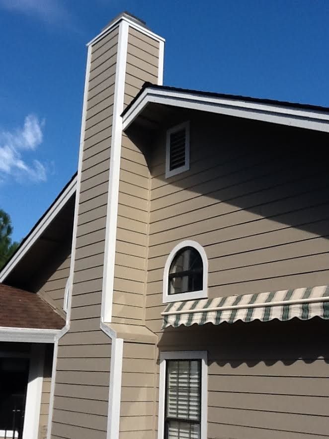 a house with a chimney on the side of it