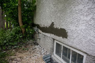 a concrete wall with a window.