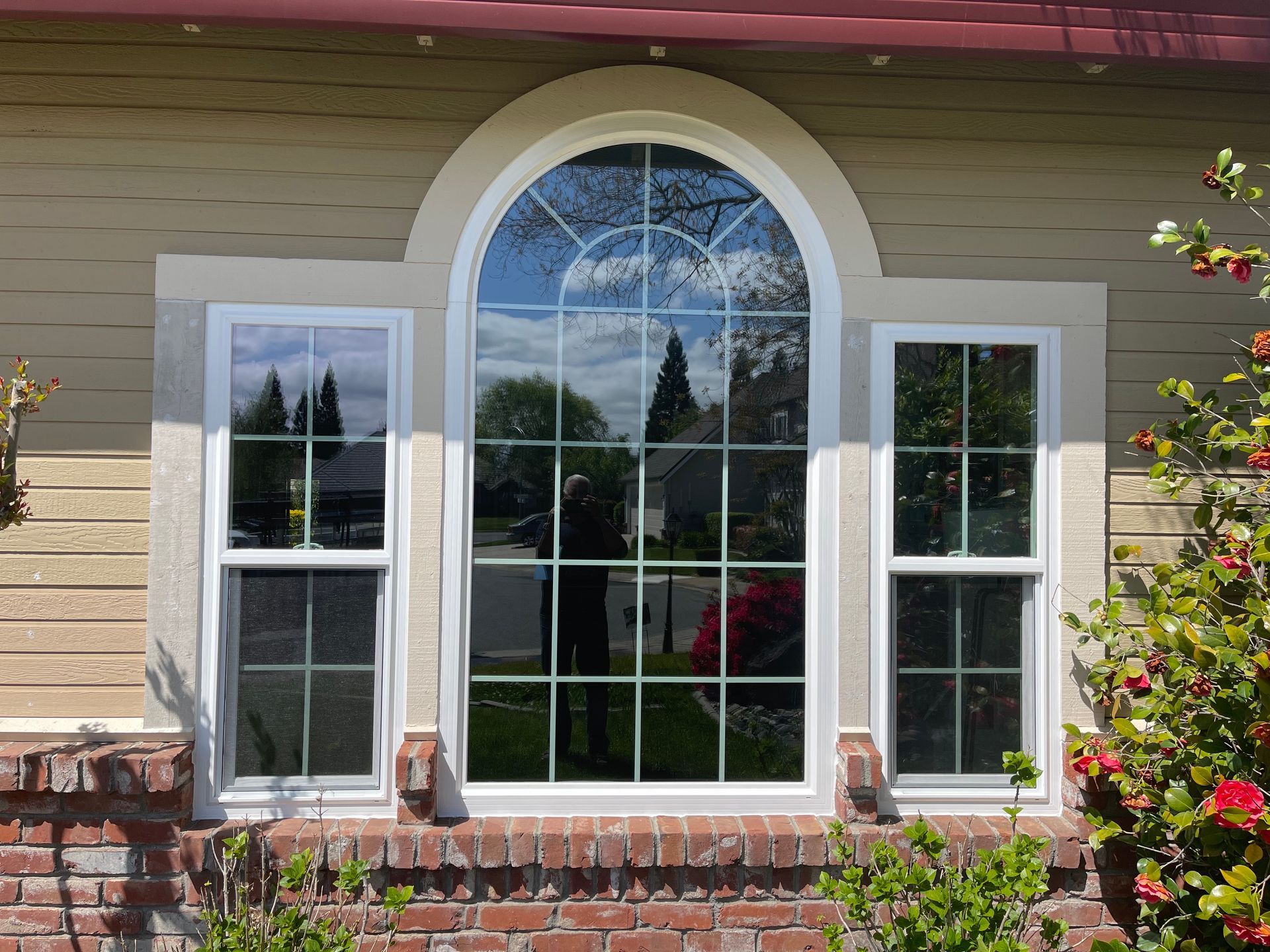 a large arched window on the side of a house