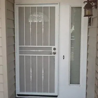 a white door with a screen on it and a window.