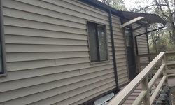 a house with a porch and stairs.