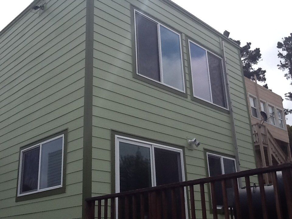 a green house with lots of windows.