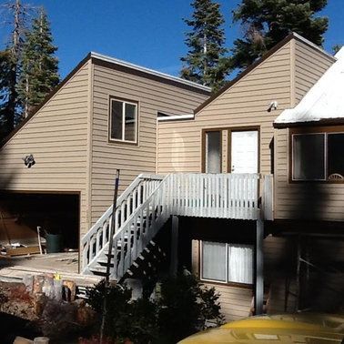 a house with stairs leading up to the second floor